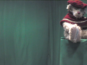 315 Degrees _ Picture 9 _ Teddy Bear Wearing Red Cape.png